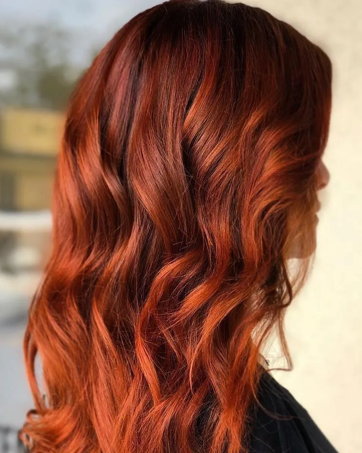 Pumpkin spice hair color at Monaco Salon Tampa — deep copper and red fall tones