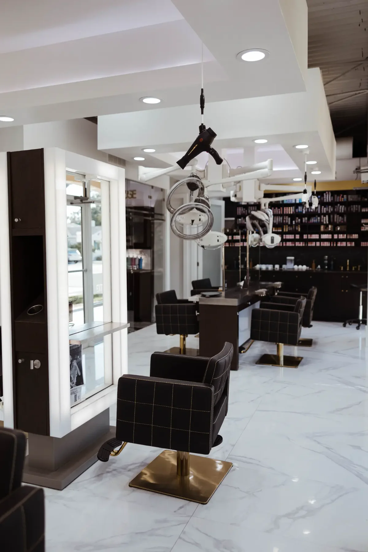 Monaco Extension Lounge full salon floor &mdash; gold-base chairs, South Tampa extension studio