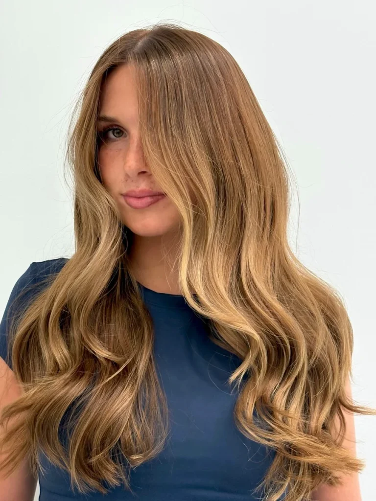 Warm honey blonde balayage client result — Monaco Salon South Tampa