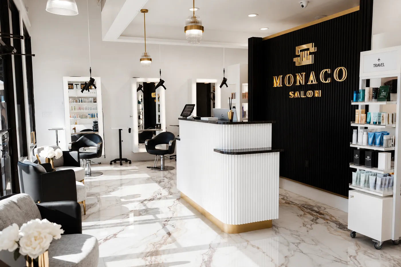 Monaco Hair Salon Tampa — Dale Mabry reception desk, Monaco gold sign, marble floors, South Tampa