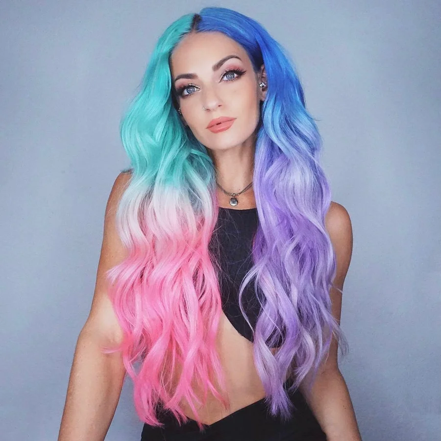 Split-color vivid hair &mdash; teal to pink and blue to lavender at Monaco Salon Tampa